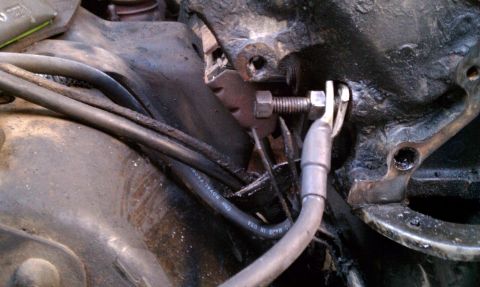 1990 Ford Bronco - Detail of engine block and wiring harness, with visible text on a cable.