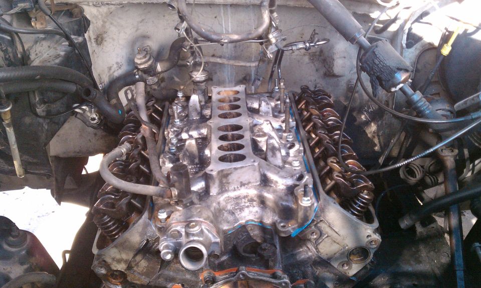 Engine intake manifold removed, showing valve train components