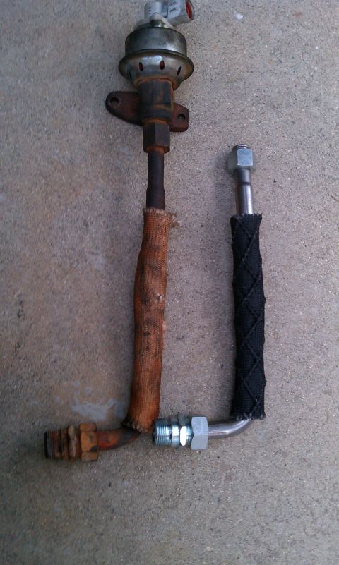 1990 Ford Bronco - Two fuel line components, one appears to be an original part and the other a replacement.