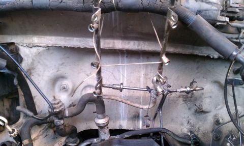 1990 Ford Bronco - Close-up view of engine bay components and hoses.
