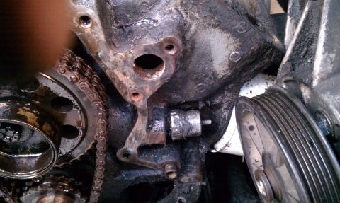 1990 Ford Bronco - Engine timing chain and gears are visible in this close-up view.