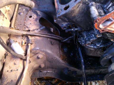 1990 Ford Bronco - Engine block and frame detail, likely from a vehicle undergoing repair or rebuild.