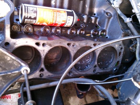 1990 Ford Bronco - Engine block with a can of spray paint resting on top, part of a rebuild project.
