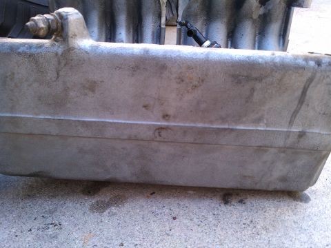 1990 Ford Bronco - Close-up of an aluminum intake manifold, likely for a Ford vehicle.