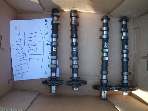 1994 Mazda MX-6 - A handwritten note indicates these camshafts are for a 1994 Mazda MX-6, but the parts themselves are the primary subject.