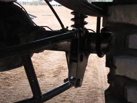 1995 Ford Bronco - Aftermarket rear suspension components, including a linkage and coilover shock, are visible in this close-up shot.