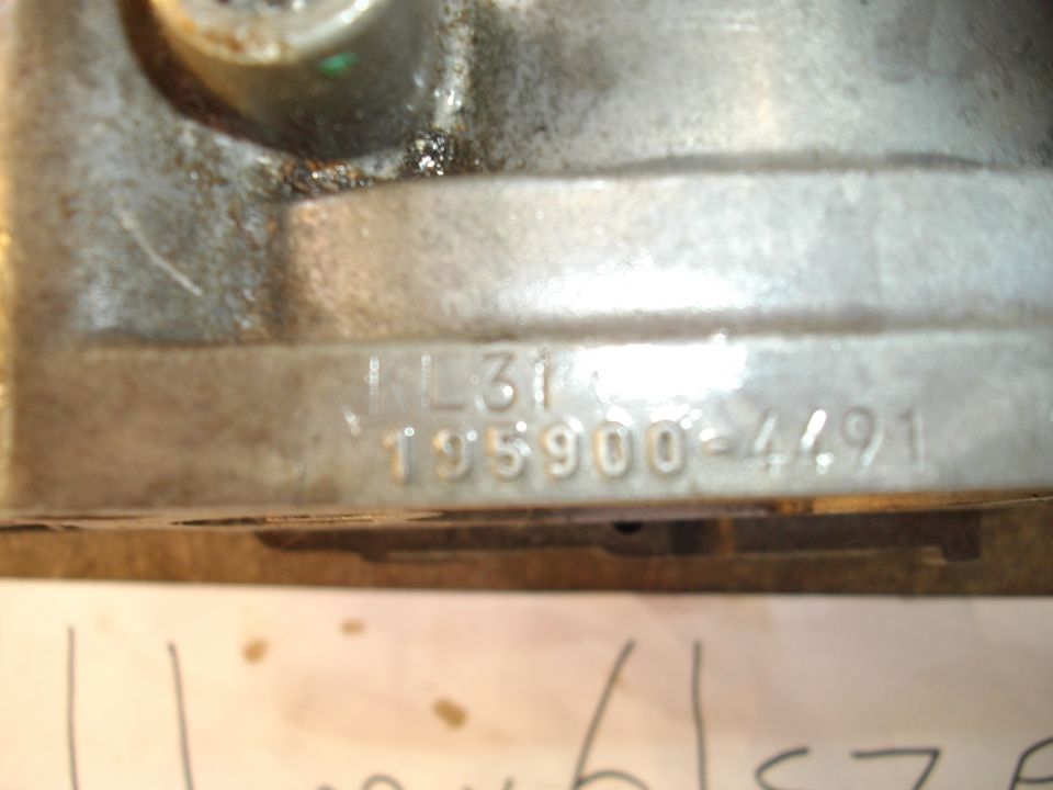 Close-up of a metal part with stamped numbers '1L31' and '195900-4491'