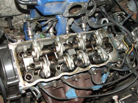 1991 Ford Festiva - Engine valve train components, including rocker arms and springs, are shown in this close-up view.