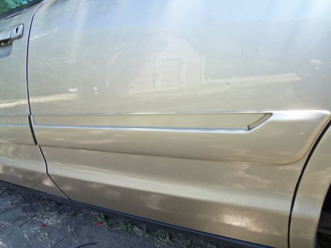 2000 Mercury Grand Marquis - Side view of the door trim on a 2000 Mercury Grand Marquis.