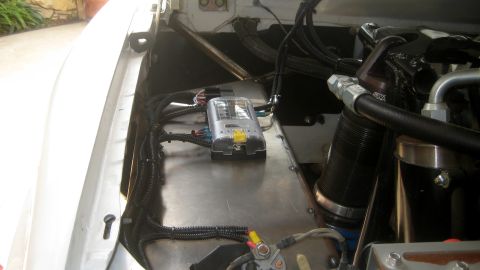 1996 Ford Bronco - Close-up of engine bay wiring and fuse box, likely a custom installation.