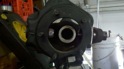 1970 Ford Bronco - Close-up of a vehicle's steering knuckle assembly, appearing to be a spare part.