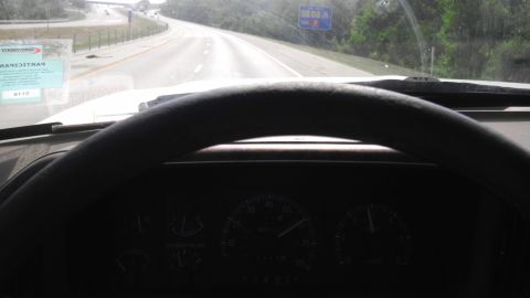 1989 Ford Bronco - Driving down a highway, view from the driver's seat of a 1989 Ford Bronco.