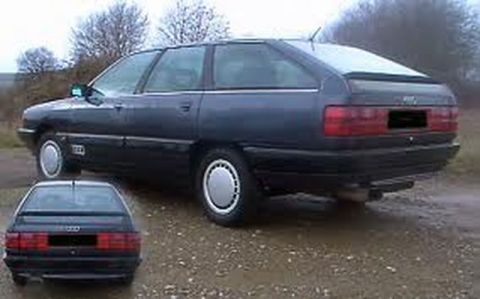 1991 Ford LTD Crown Victoria - Dark blue Audi 100 Avant from the rear-three-quarter view, with a smaller inset photo of its rear.