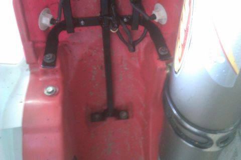 2002 Honda XR600R - This is a close-up view of the mounting hardware for a motorcycle's rear fender.