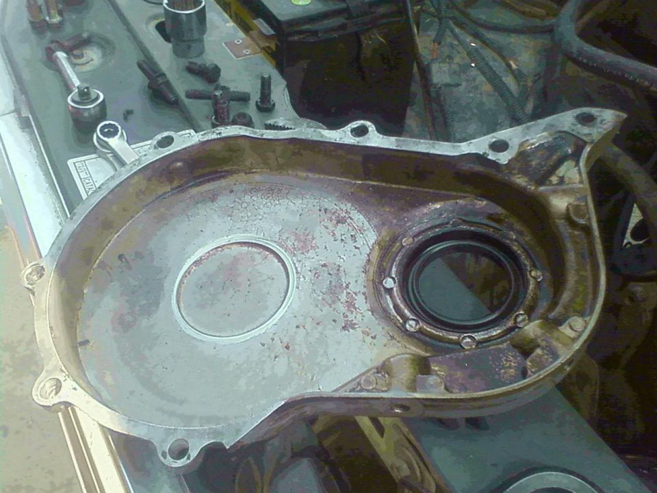 The only thing holding the cam in the engine was the timing cover.  Can see the worn shiny spot in the center where the cam gear was rubbing against it.
