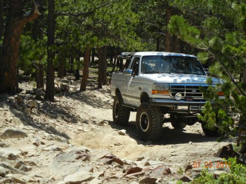 1996 Ford Bronco - This lifted 1996 Ford Bronco navigates a , wooded path.