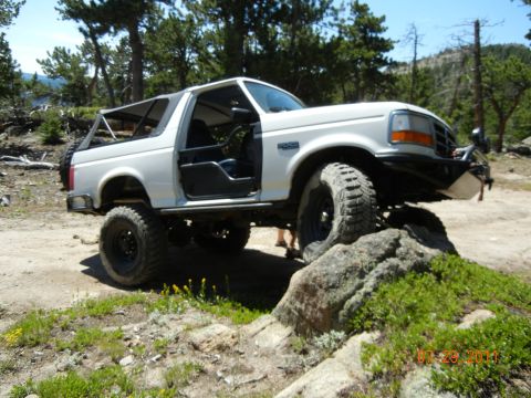 1996 Ford Bronco - This modified Ford Bronco is shown navigating a rocky off-road course.