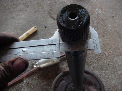 1992 Ford Bronco - Calipers measure a black cylindrical part, likely a component for a vehicle.