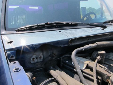 1991 Ford LTD Crown Victoria - View of the engine bay and windshield wipers, with another vehicle visible in the windshield reflection.