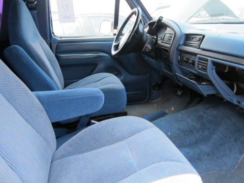 1991 Ford LTD Crown Victoria - The interior of a 1992 Ford F-Series truck, showing blue cloth seats and dashboard.