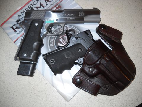 1986 Ford Bronco II - Springfield Armory 1911 pistol and holster are laid out on a magazine.