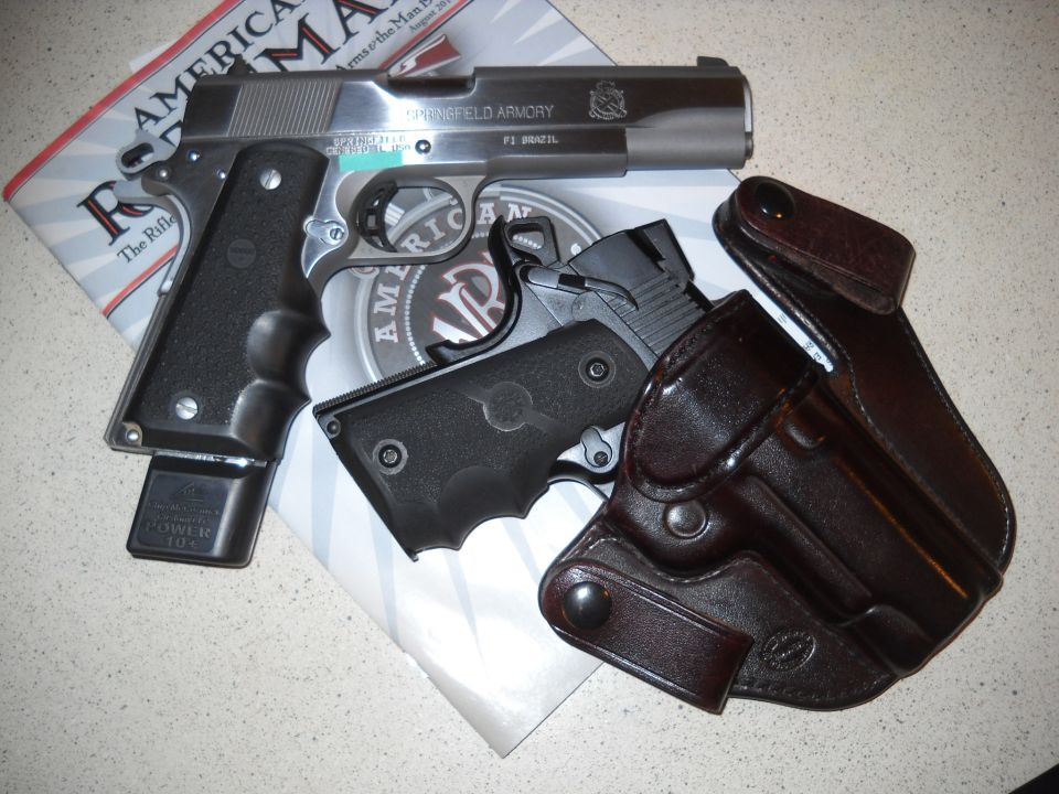 Springfield Armory 1911 pistol with extended magazine and leather holster