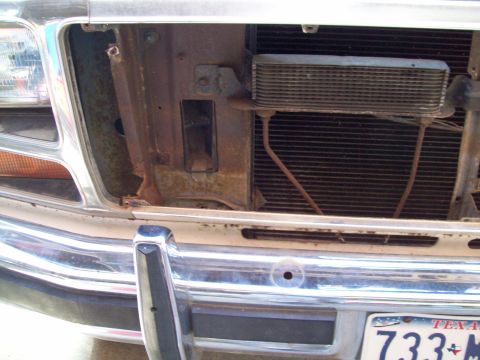 1985 Ford Bronco - Close-up view of the front grille and radiator area, showing the oil cooler and associated lines.