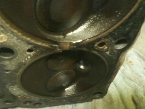 1988 Ford Bronco - This is a close-up view of an engine's cylinder head, showing the intake and exhaust valves.