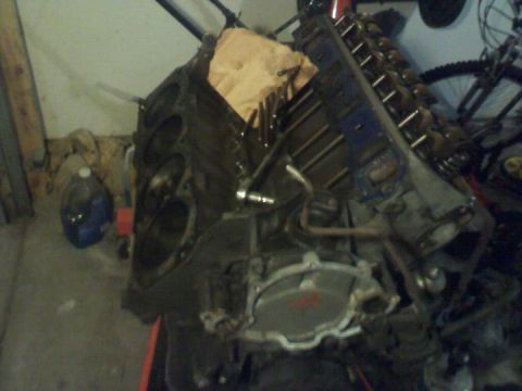 1988 Ford Bronco - Engine block and components are shown in a workshop setting.