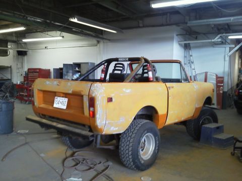1978 International Scout II - This yellow International Scout II is in a garage, possibly undergoing restoration or modification.