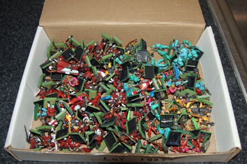 1978 Chevrolet C/K Pickup - A box filled with numerous miniature figures, appearing to be from a game or collection.