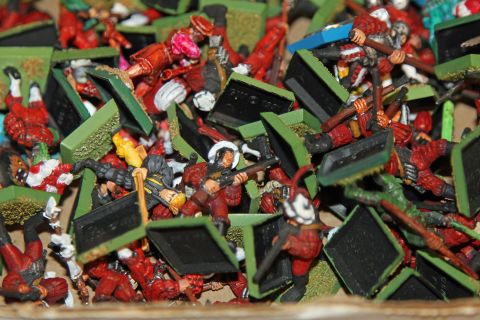 1978 Chevrolet C/K Pickup - A jumbled collection of miniature soldiers, painted in red and green, are piled together.