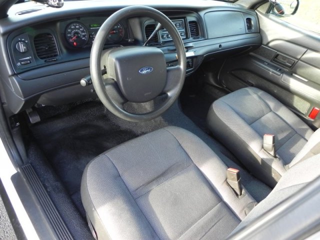 2006 Ford Crown Victoria interior showing dashboard, steering wheel, and front seats