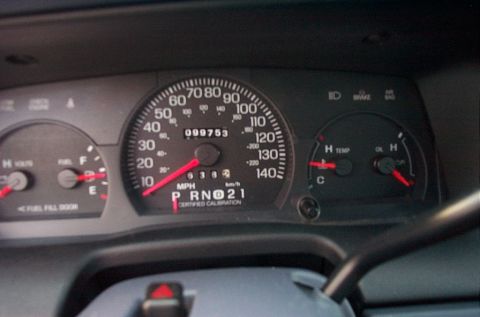 2001 Ford Crown Victoria - Dashboard gauges show odometer reading 099753, fuel level, engine temperature, and oil pressure.