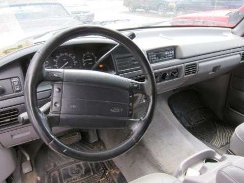 1991 Ford LTD Crown Victoria - The interior of a Ford truck shows the steering wheel, instrument cluster, and dashboard controls.