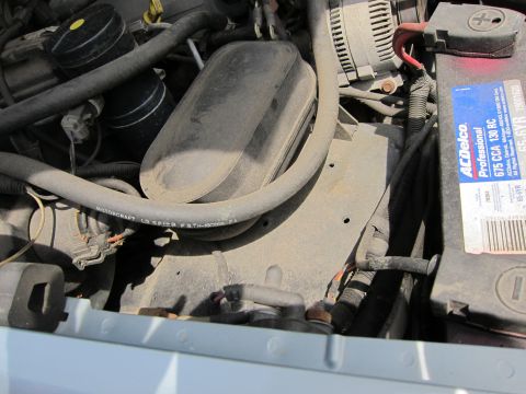 1991 Ford LTD Crown Victoria - Close-up view of a vehicle's engine bay, showing various components and wiring.