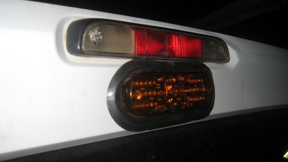 Amber LED light below third brake light