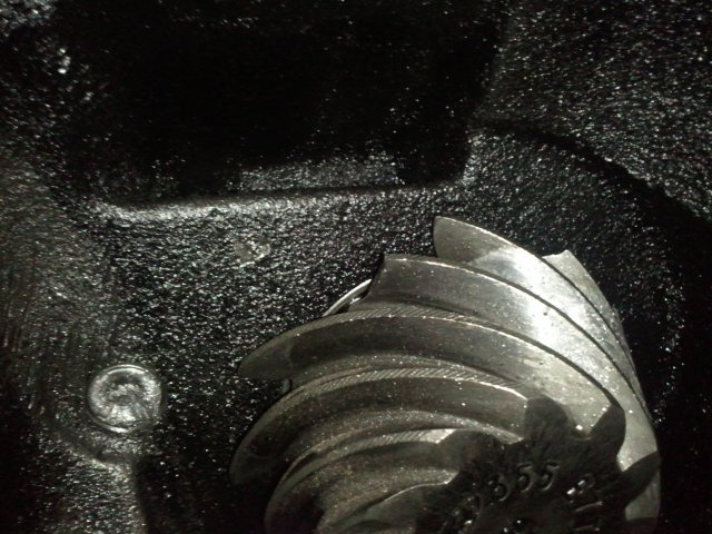Close-up of a differential gear with '55' visible on it