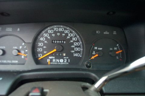 2001 Ford Crown Victoria - Dashboard gauges including speedometer, fuel, temp, and oil pressure. Odometer reads 129478 miles.