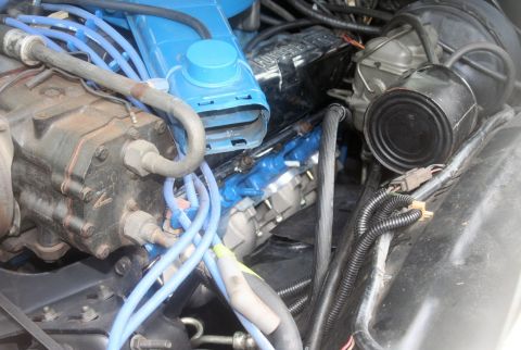 1976 Ford Ranchero - A detailed view of an engine compartment, focusing on various mechanical parts and wiring.