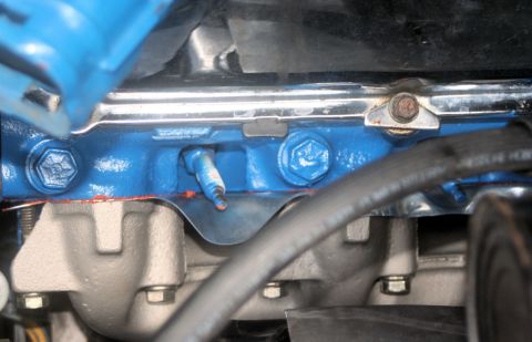 1976 Ford Ranchero - Close-up of an engine component, possibly a spark plug, with blue paint and a SuperMotors.net watermark visible.