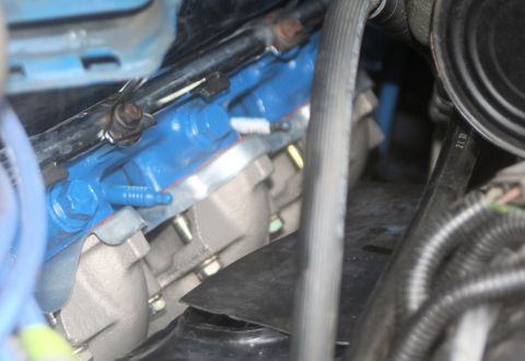 1976 Ford Ranchero - Engine components, including a blue manifold and various hoses, are visible in this close-up shot.