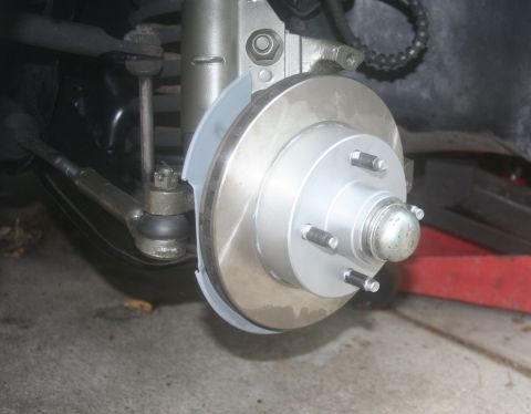 1980 Ford Mustang - Close-up of a front brake rotor and associated suspension components, with "Supermotors.net" visible at the bottom.