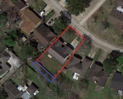 1993 Ford F-250 - An aerial view shows houses, yards, and streets, with property lines highlighted by red and blue markings.