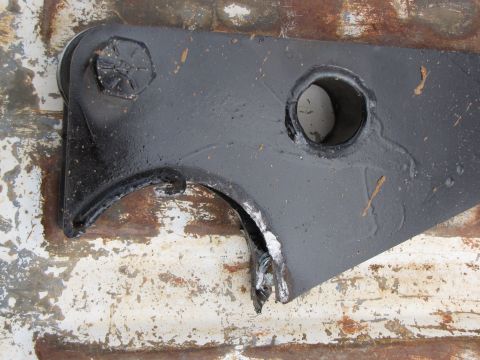 1995 Ford Bronco - Close-up of a damaged suspension part, likely from a truck or SUV.