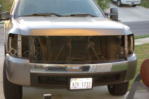 2007 Chevrolet Silverado 1500 - Truck front end with headlights removed, showing the radiator and internal components.