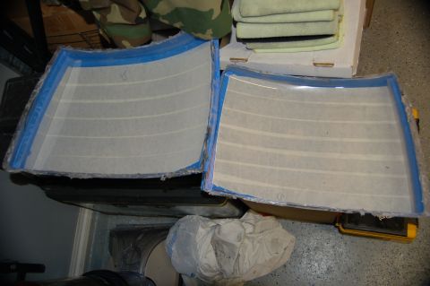 2007 Chevrolet Silverado 1500 - Two custom headlight molds are prepared for modification, showing the interior lining.