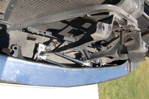 2007 Chevrolet Silverado 1500 - Close-up view of the front bumper and radiator support assembly, revealing internal components and mounting hardware.