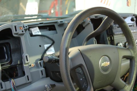 2007 Chevrolet Silverado 1500 - Interior view of a 2007 Chevrolet Silverado 1500 dashboard, showing exposed wiring and components.