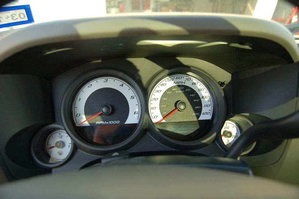 Dashboard gauges with tachometer and speedometer